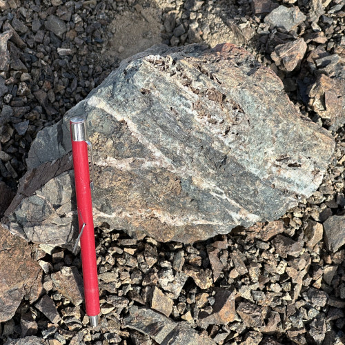 Quartz and Epidote veins (Stockwork) with copper oxides and limonites.